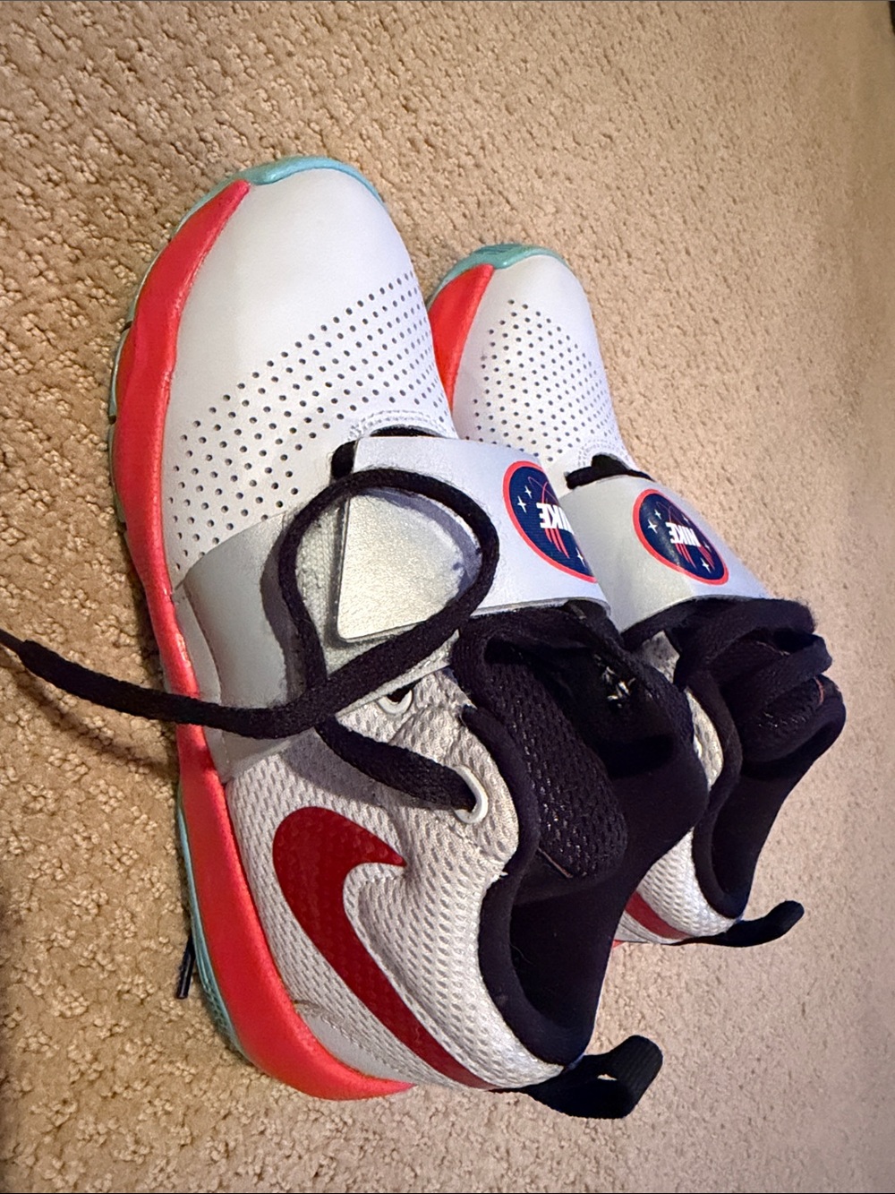 Nike Kids White Sneakers with Red Swoosh and Aqua Accents